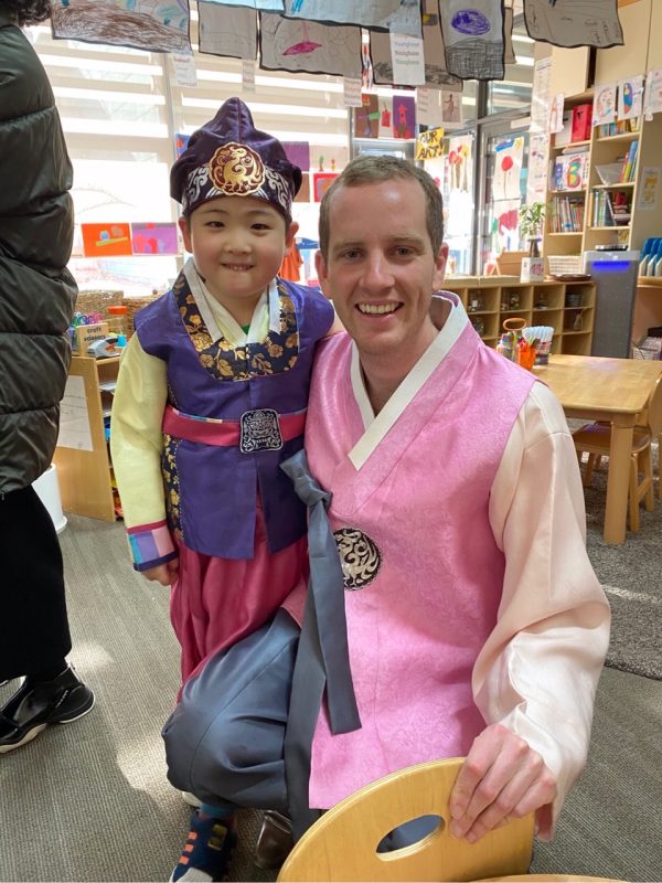 International school teacher with student