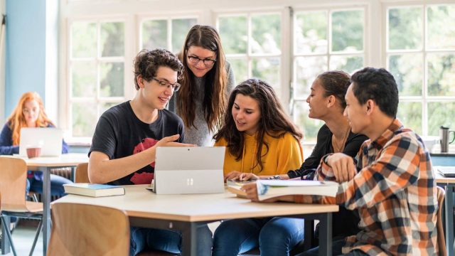 Students working at laptop