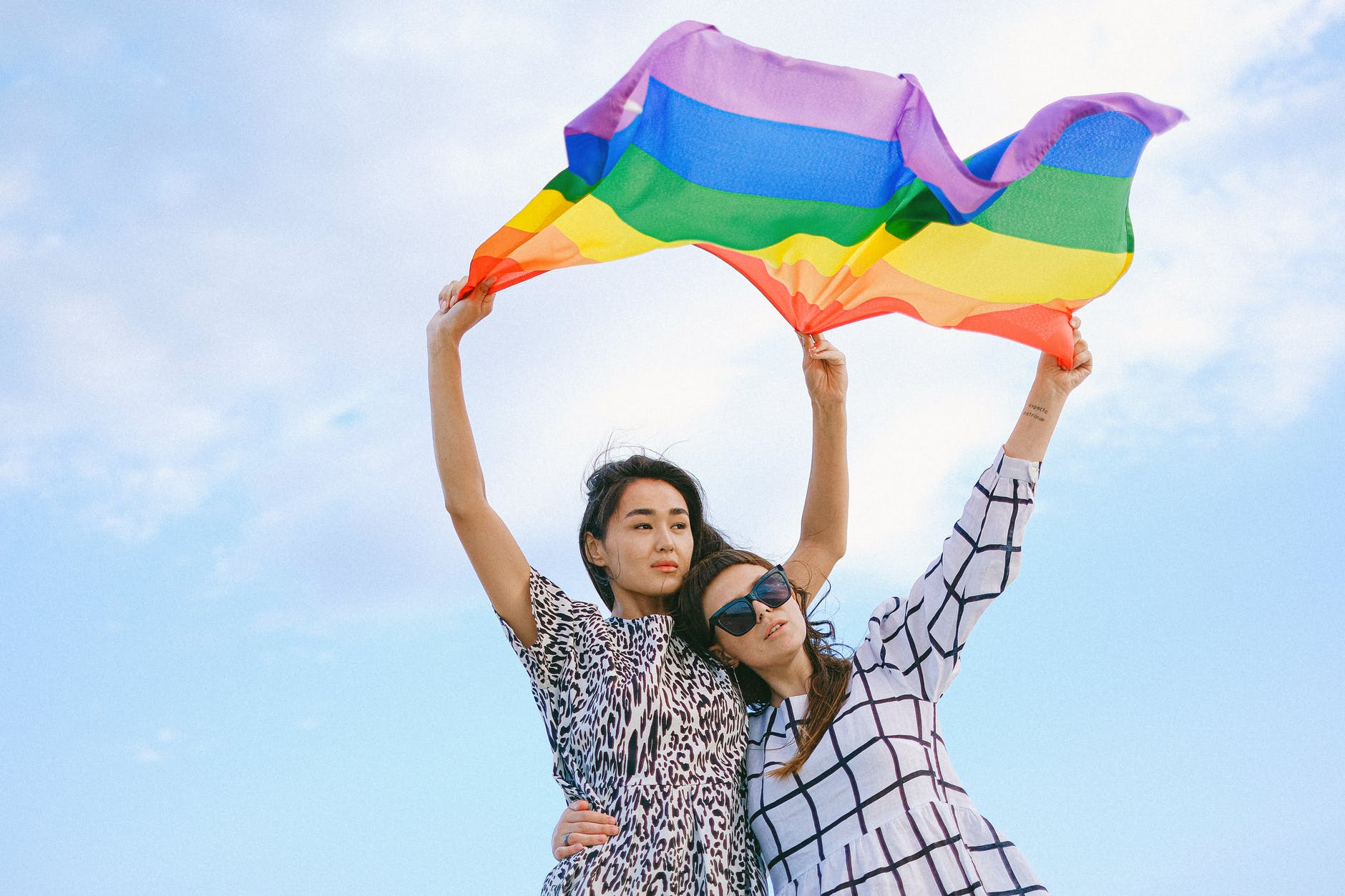 Couple holding pride flag