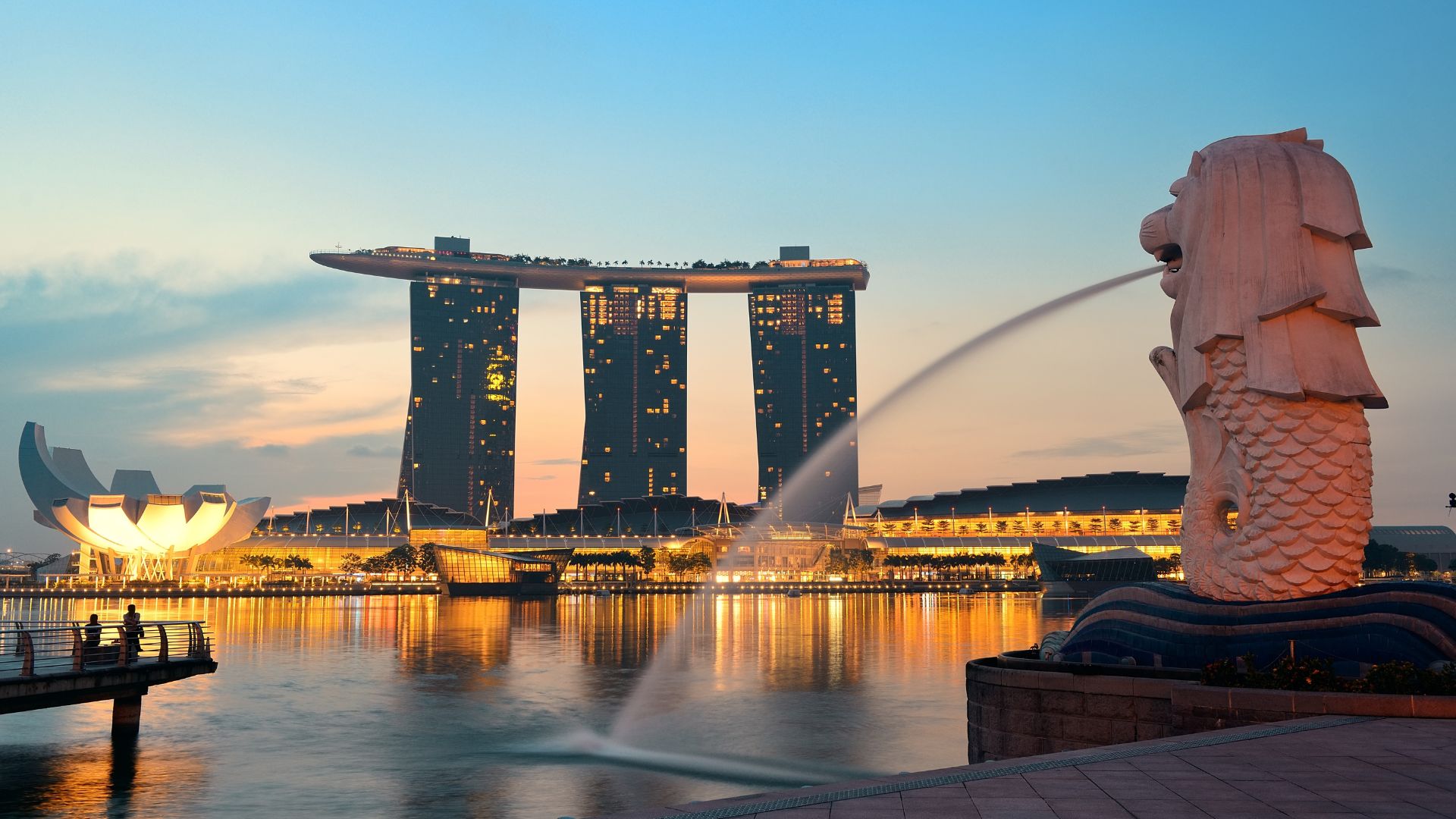 Iconic skyline with Merlion statue.