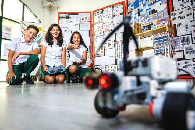 Students with a robot