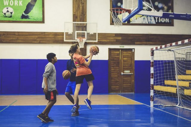 Students playing basketball