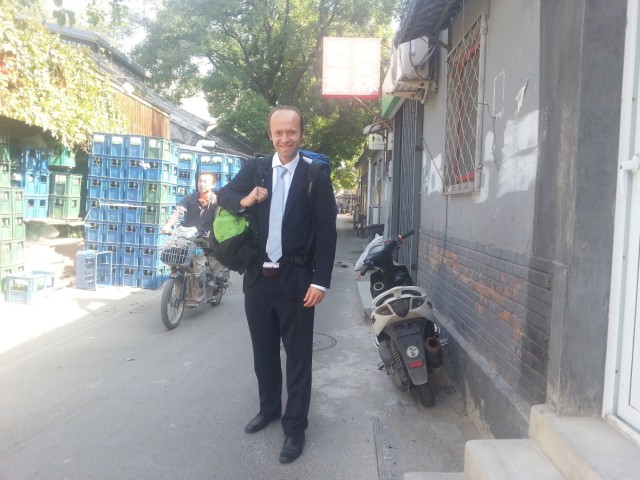 Alexis in the Hutongs ready for a meeting at The Beijing British School. Notice the backpack (s) – doesn't quite fit with the suit!