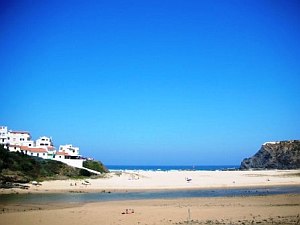 beach-with-houses-on-hill