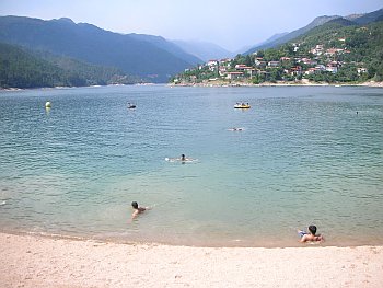 bathers-in-water-among-hills