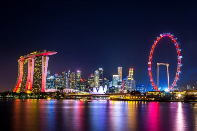 Singapore skyline illuminated at night - Teaching in Singapore