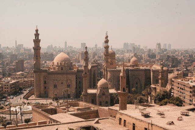 Historic mosques in a city skyline.
