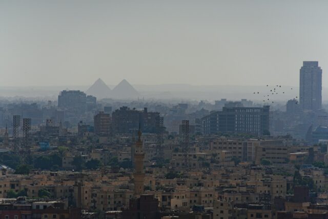 Cityscape with pyramids in the background while teaching in Egypt
