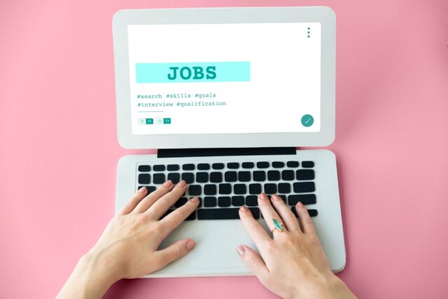 Laptop displaying job search results for international schools hire.
