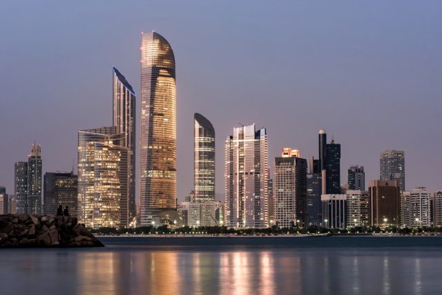 Modern high-rise skyscrapers and iconic architecture in Dubai under a clear sky.
