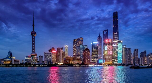 Nighttime view of Shanghai's iconic skyline and skyscrapers, representing job opportunities for teaching English in China.