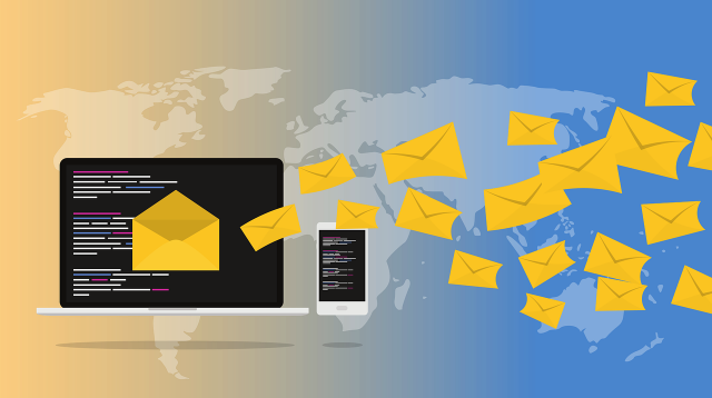 Laptop and smartphone sending multiple yellow email envelopes across a world map, symbolizing global email marketing and digital communication.