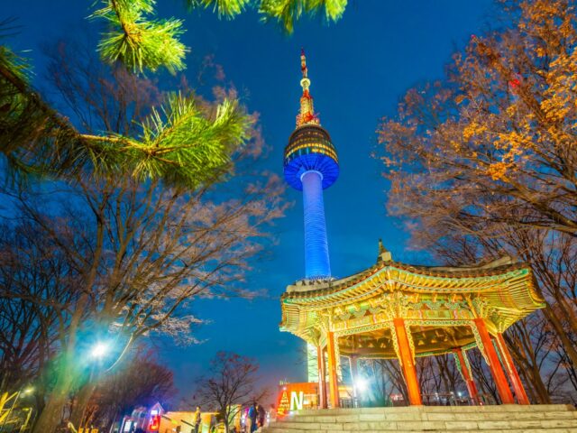 N Seoul Tower and traditional pavilion illuminated at night, representing opportunities to teach English in South Korea.