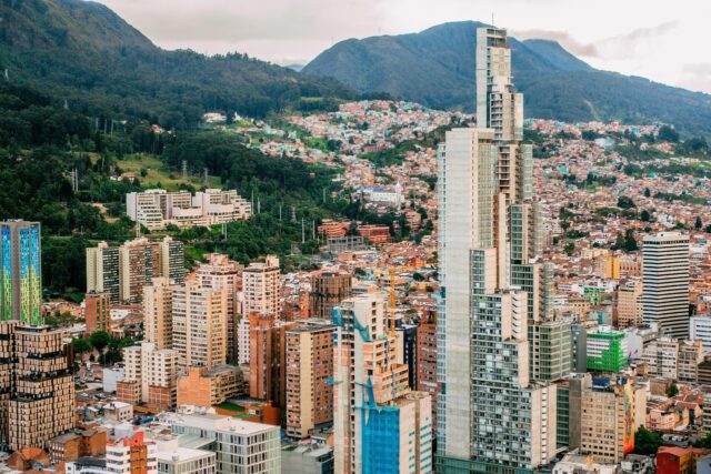 Skyline of Medellín set against rolling green mountains, representing teaching English in Colombia and Latin America.