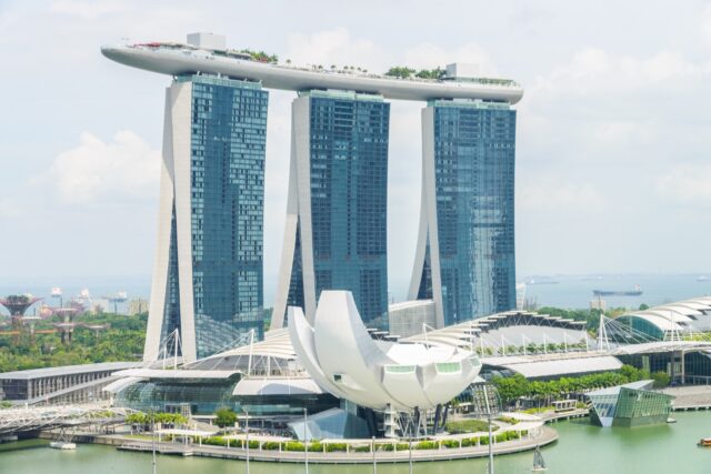 Marina Bay Sands hotel towers and ArtScience Museum viewed across the waterfront in Singapore.