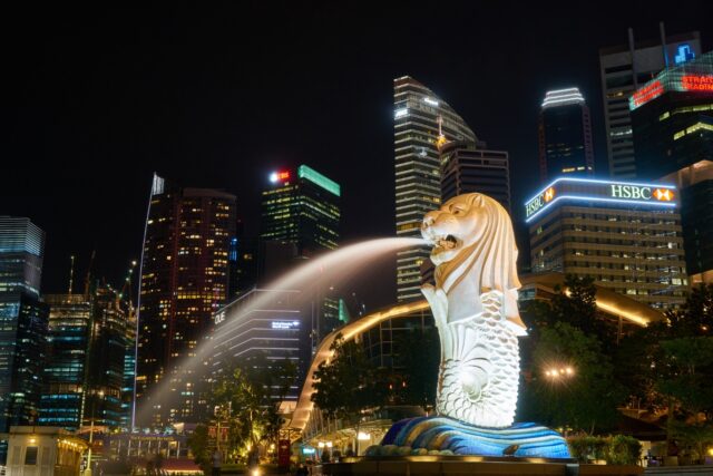 Merlion statue with city skyline backdrop