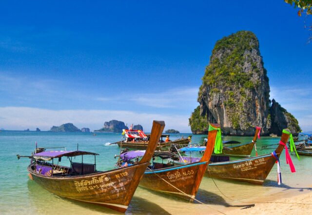 Longtail boats on a tropical beach - Teaching in Thailand