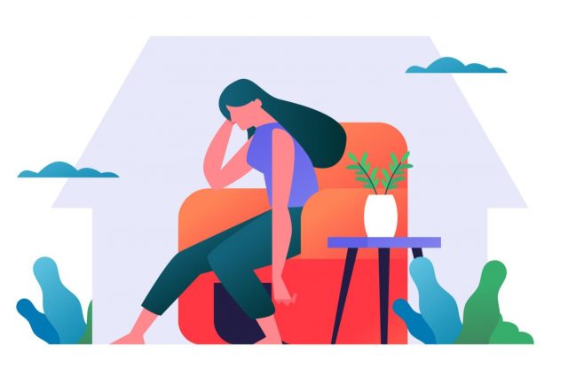 Woman on armchair looking sad