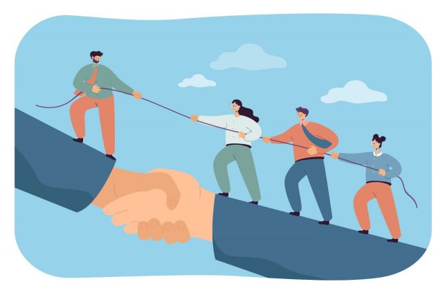 A group of business people working together to pull each other up a rope, illustrating unity and collaboration in the workplace.